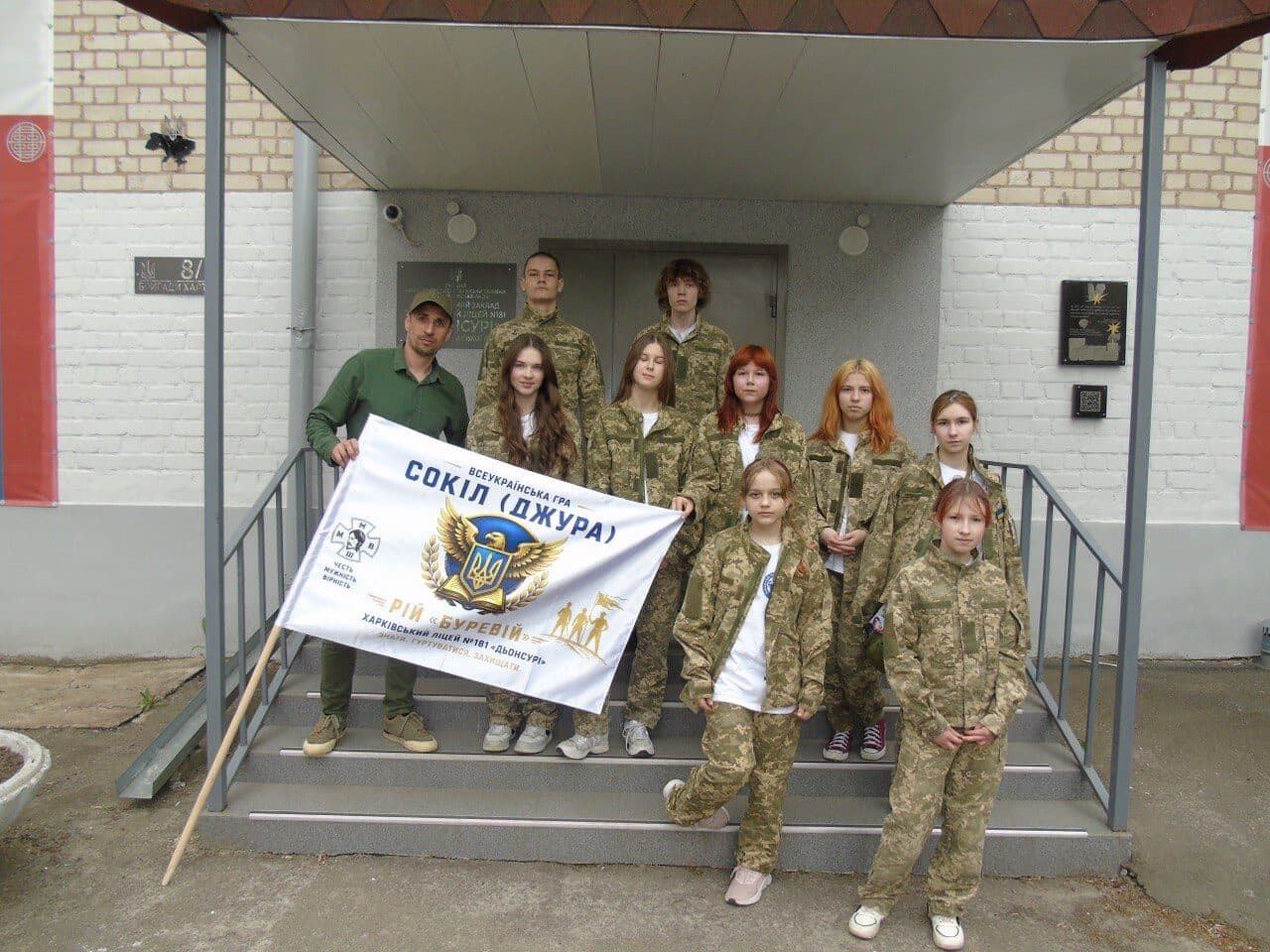 Ukrainian youth partners holding their group banner